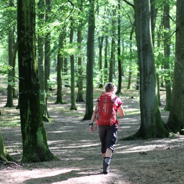 Person running with a bag full of supplies